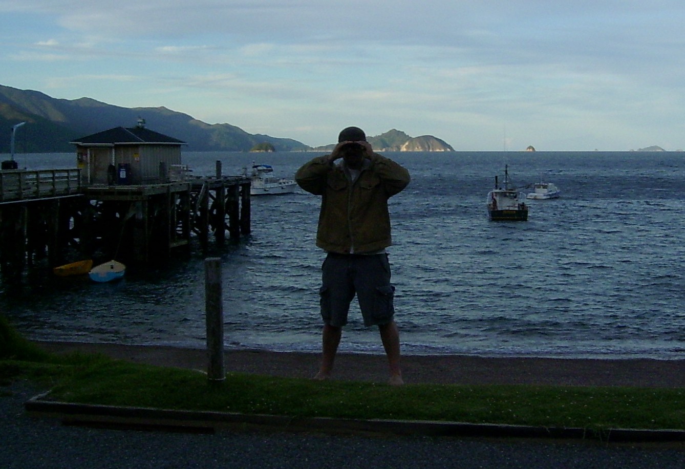 there's also an insignificantly small rocky outcrop named Stewart Island in English in the Marlborough Sounds, here one of our crew standing by it in French Pass.  Stewart Island is the small rock in the mid-right of the photo in the distance)